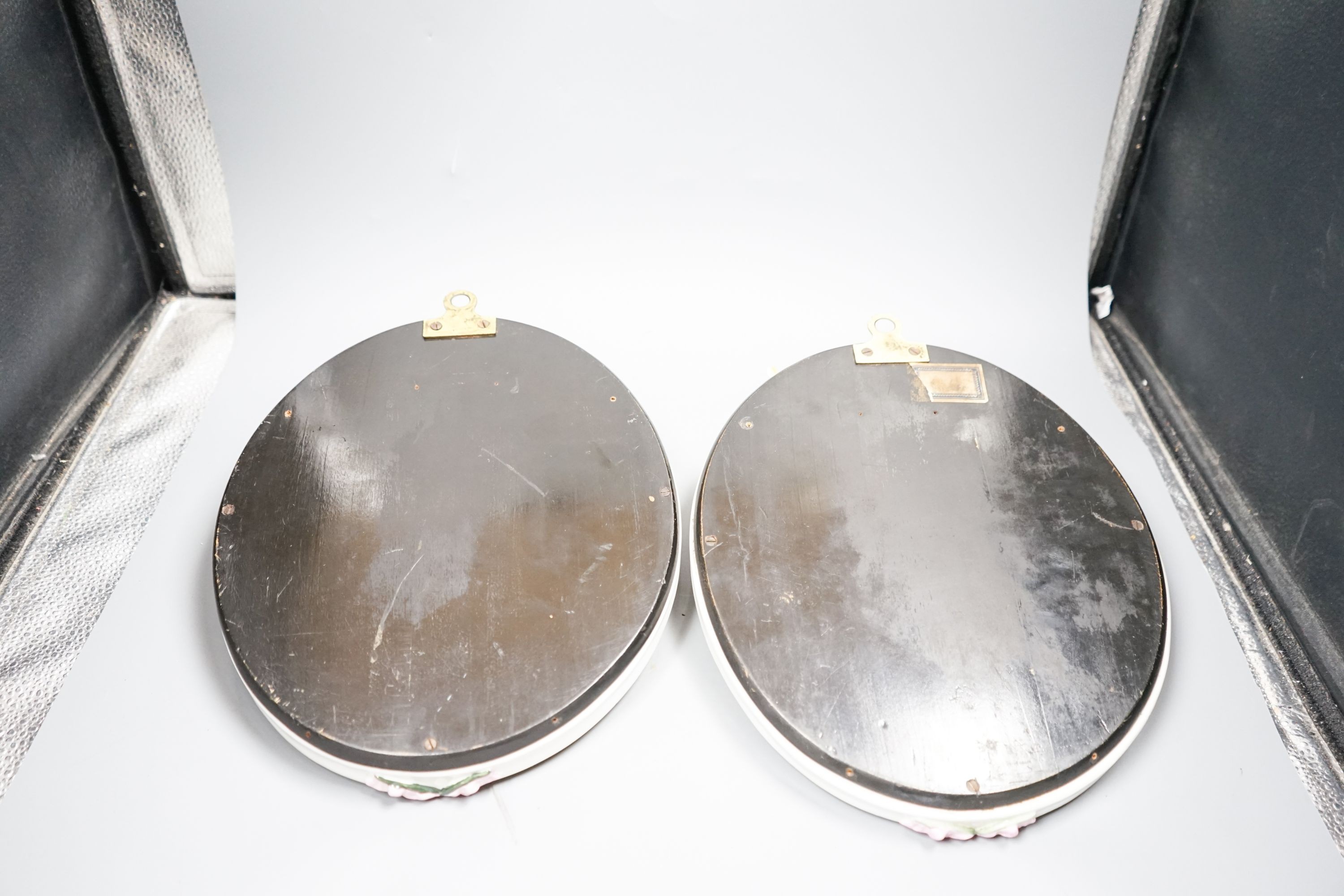 A pair of Sitzendorf oval mirror frames, 33cm